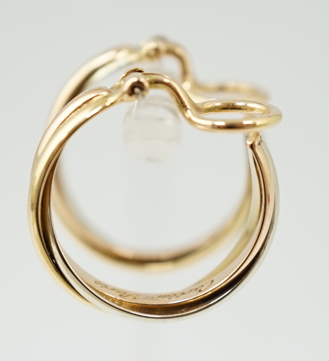 A pair of French Cartier three colour 18ct gold interwoven hoop ear clips